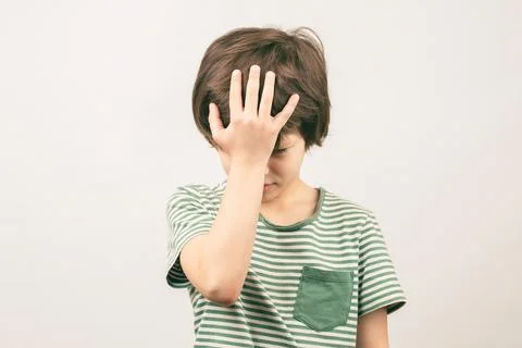 Boy placing hand on head. Face palm gesture Stock Photos