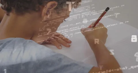 Boy placing hand on paper and writing code lines at desk, activating technology Stock Footage 315533948