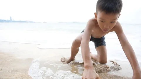 Boy play on the beach in summer Stock Footage 73374251