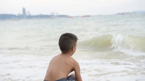 Boy play on the beach in summer 스톡 동영상 75562690