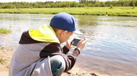 Boy play game on  smartphone Stock Footage 52461562