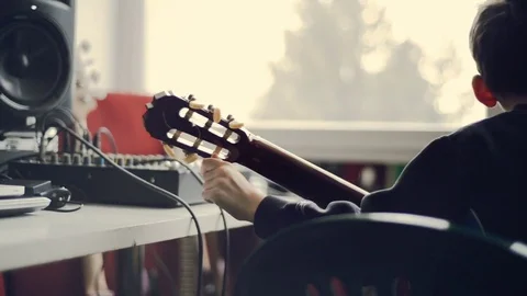 Boy play guitar Stock Footage 77163336