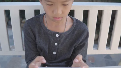 Boy play a smartphone Stock-Footage 103970883