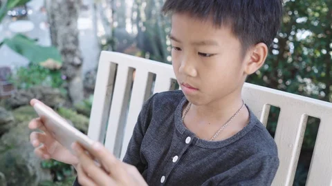 Boy play a smartphone Stock-Footage 103971018