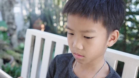 Boy play a smartphone Stock-Footage 107809712