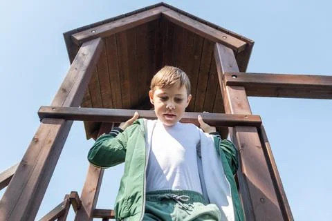 Boy on a Play Structure Looking Down from Above, Summer Activities and Fun,.. Stock Photos
