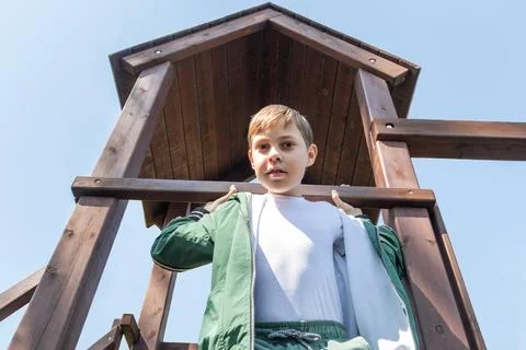 Boy on a Play Structure Looking Down from Above, Summer Activities and Fun,.. Stock Photos