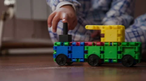 Boy play with toy train Stock Footage 44548956