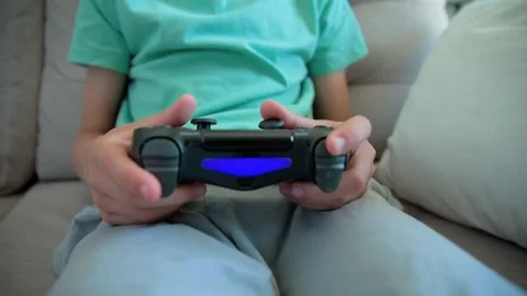 Boy play video game, use gamepad 스톡 동영상 201074224