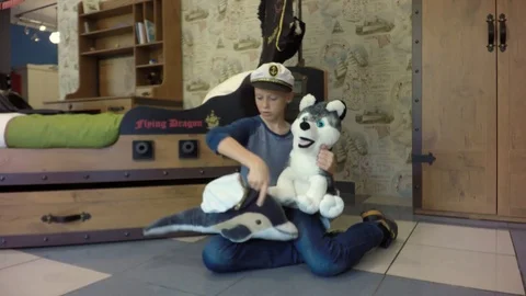 The boy is played by a dolphin and a bear. Stock Footage 84265029