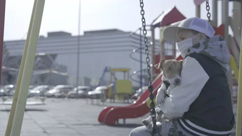 Boy on the playground with a dog  Video stock 141593529