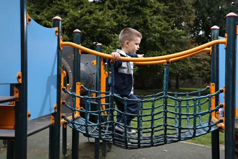 Boy on a playground Stock Photos