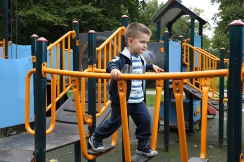 Boy on a playground Stock Photos