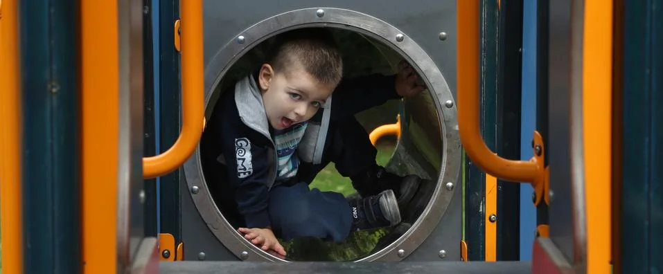 Boy on a playground Stock Photos