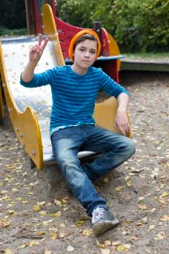Boy on playground Stock Photos