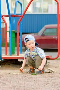 Boy on playground Stock Photos
