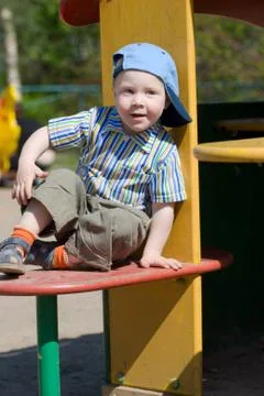Boy on playground Stock Photos