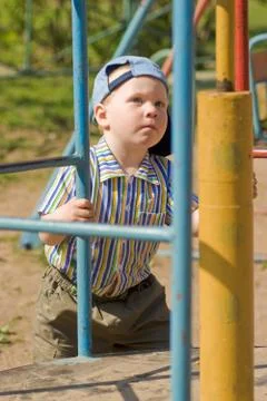 Boy on playground Stock Photos