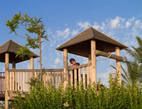The boy on the playground at the seaside Stock Photos