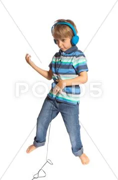 Boy playing air guitar and dancing Stock Photos