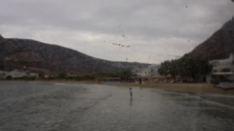 Boy playing alone on the beach Stock Footage 296970080