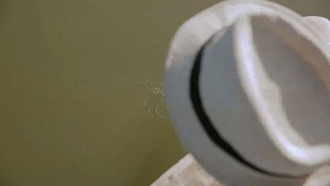 Boy playing and moves the hand in water Stock Footage 76168550