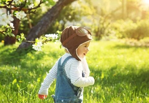 Boy playing in aviator hat Stock Photos