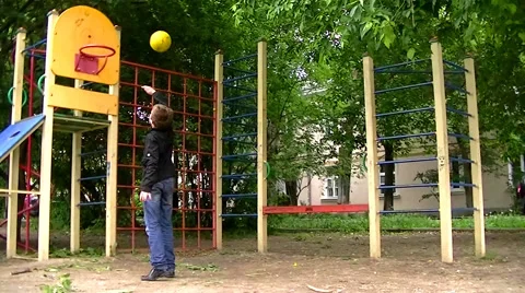 Boy playing ball in basketball Stock Footage 64166102