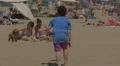 Boy playing with a ball on the beach in Barcelona 4k or 4k+ Resolution