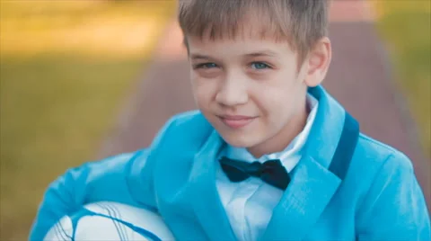 Boy Playing With a Ball in Front of Camera Stock Footage 68804558