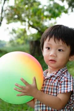 Boy playing with ball Stock Photos