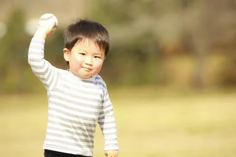 Boy playing with a ball Stock Photos