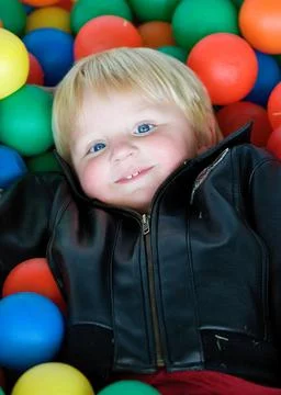 Boy Playing in Ball Pit Stock Photos