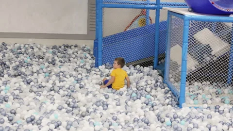 Boy playing in ball pool. Stock Footage 264271168