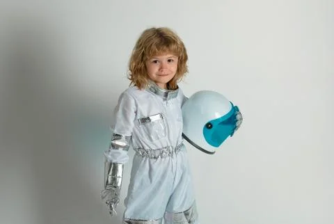 Boy playing to be an astronaut with space helmet and metal suit. Little boy Stock Photos