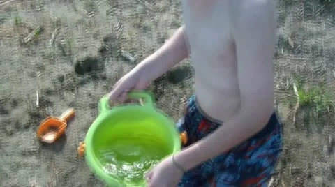 Boy Playing on Beach Video stock 12571804