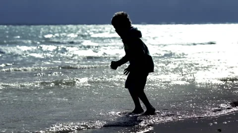 Boy Playing at the Beach Stock Footage 58732839