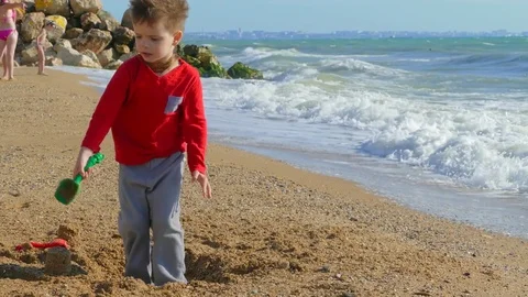Boy playing on the beach Video stock 78232841
