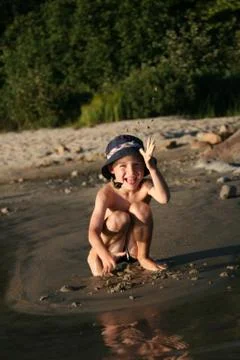 Boy playing at beach Stock Photos