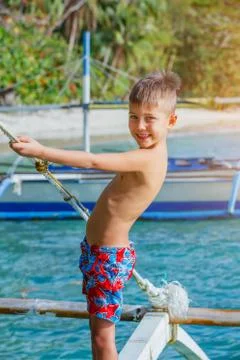Boy playing at the beach. 写真素材