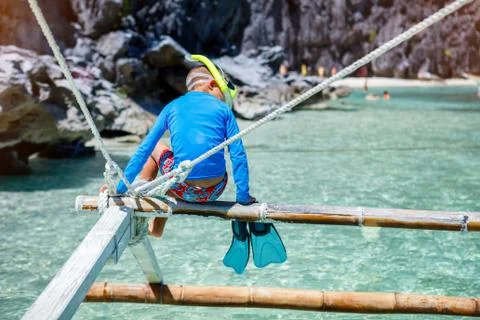 Boy playing at the beach. 写真素材