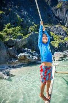 Boy playing at the beach. Foto stock