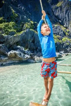 Boy playing at the beach. Foto stock