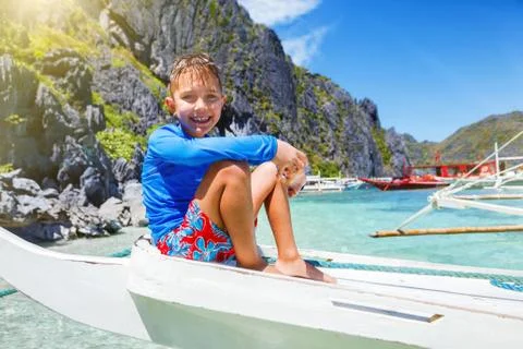 Boy playing at the beach. 写真素材