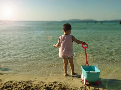 Boy playing by the beach Stockfoto's