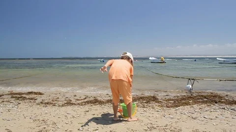 Boy playing on beach in sunny day Video stock 116733295