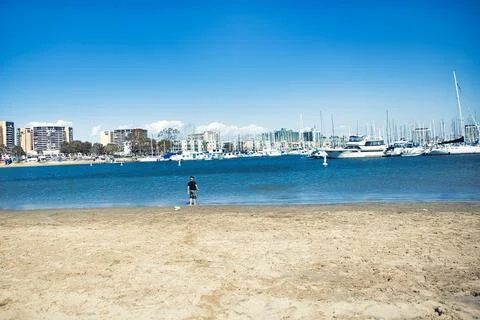 A boy playing on the beach in Venice Beach, CA Stock Photos