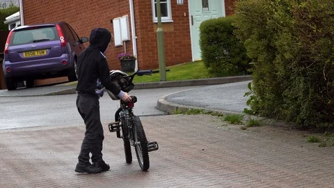 Boy playing on bicycle Stock Footage 89488745