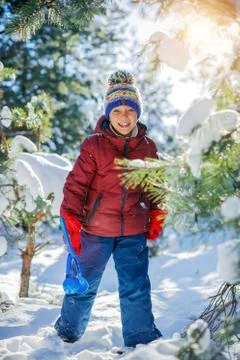 Boy playing in big snow in winter. 写真素材