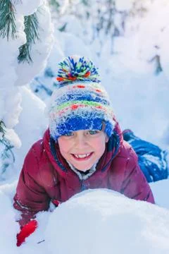 Boy playing in big snow in winter. 写真素材